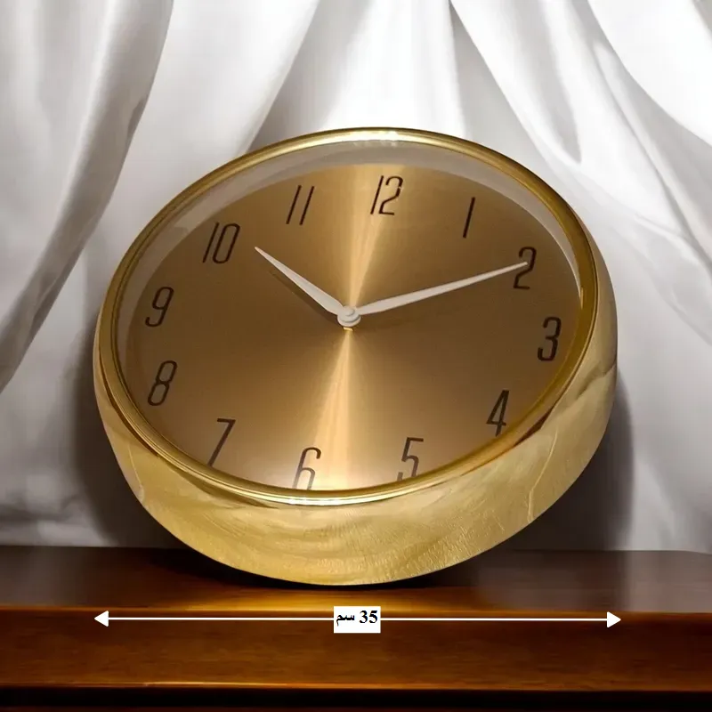 ساعة حائط ذهبية دائرية أنيقة، قطر 35 سم، موديل 029107 ساعة الحائط الدائرية تتضمن قياس قطر الساعة = 35 سم