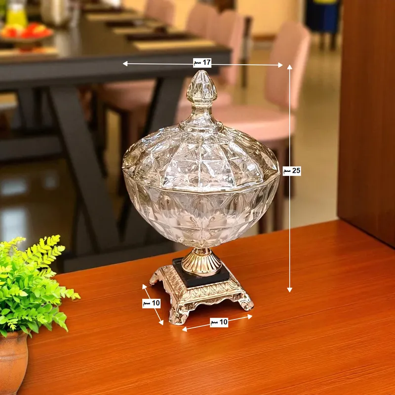 إخوان سرور الإضاءة الحديثة والديكور صورة توضح مقاسات البونبونيرة الكريستال: الارتفاع 25 سم، العرض 17 سم، والقاعدة 10x10 سم.
