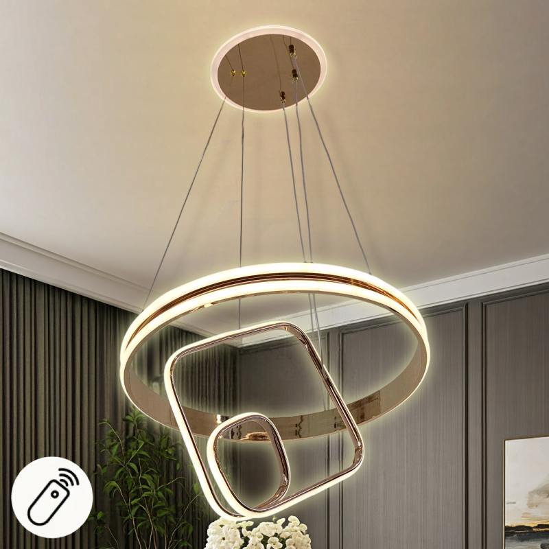 نجفة LED مودرن بتصميم هندسي يجمع بين الأشكال الدائرية والمربعة باللون الذهبي، معلقة بأسلاك قابلة للتعديل وتتضمن أيقونة ريموت كنترول للتحكم عن بُعد.